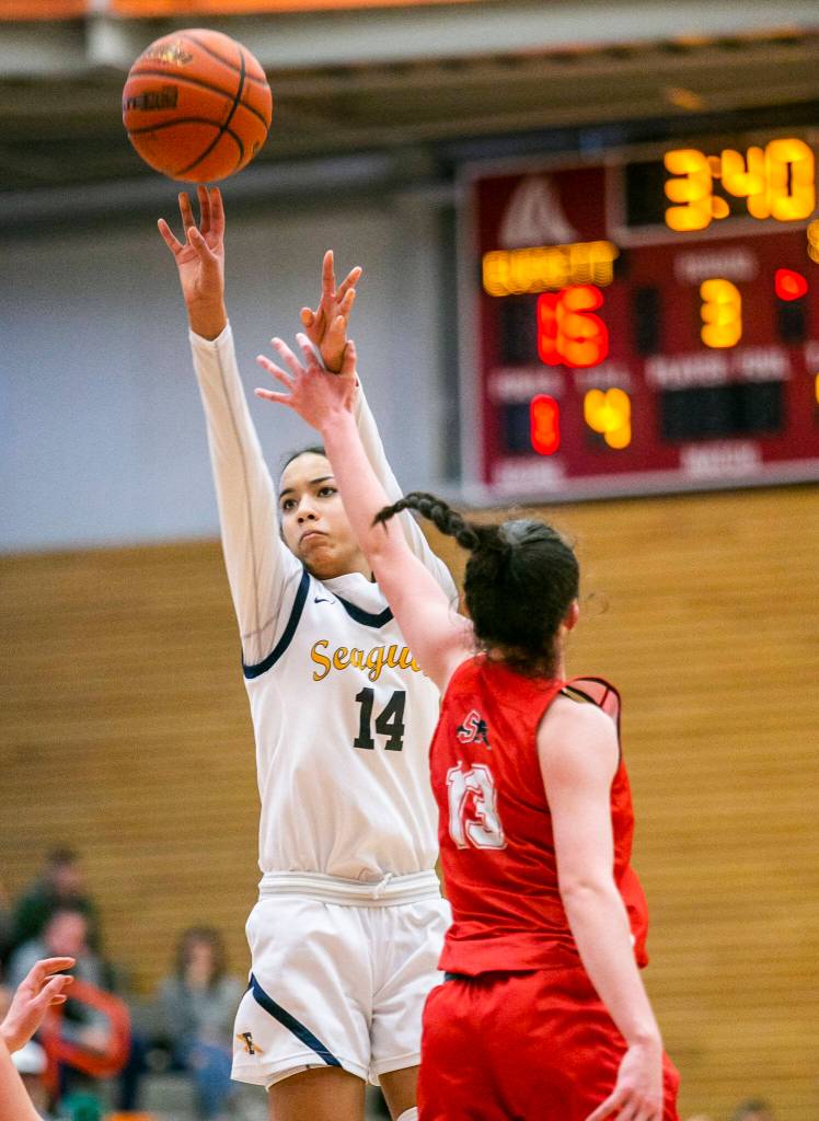 Everetts Mae Washington is fouled while taking a three-point shot during the game against Snohomish on Saturday, Feb. 18, 2023 in Everett, Washington. (Olivia Vanni / The Herald)