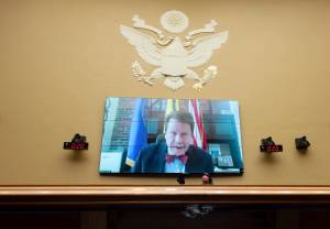 FILE - Food and Drug Administration Commissioner Robert Califf testifies via video during a House Commerce Oversight and Investigations subcommittee hybrid hearing on the nationwide baby formula shortage on Wednesday, May 25, 2022, in Washington. Califf has spent much of his last year on the job warning that growing “distortions and half-truths” surrounding vaccines and other medical products are a major driver of sickness and death in America. (AP Photo/Kevin Wolf, File)