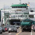 The MV Puyallup, a ferry capable of carrying 202 cars, offloads at the Edmonds Ferry dock on Sept. 21, 2018 in Edmonds. (Andy Bronson / The Herald)