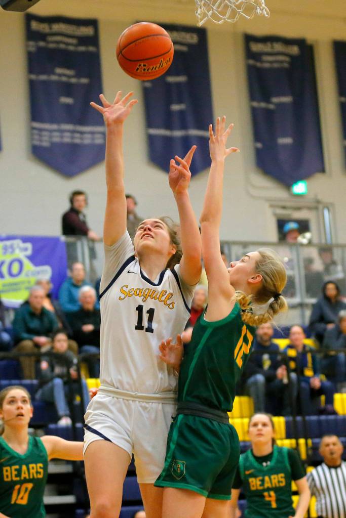 Everetts Lanie Thompson scores off a turnover against Bishop Blanchet during a first round playoff game on Tuesday, Feb. 21, 2023, at the Norm Lowery Gymnasium in Everett, Washington. (Ryan Berry / The Herald)