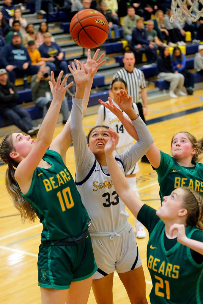 Everetts Junior Parrish tries to come down with an offensive board against Bishop Blanchet during a first round playoff game on Tuesday, Feb. 21, 2023, at the Norm Lowery Gymnasium in Everett, Washington. (Ryan Berry / The Herald)