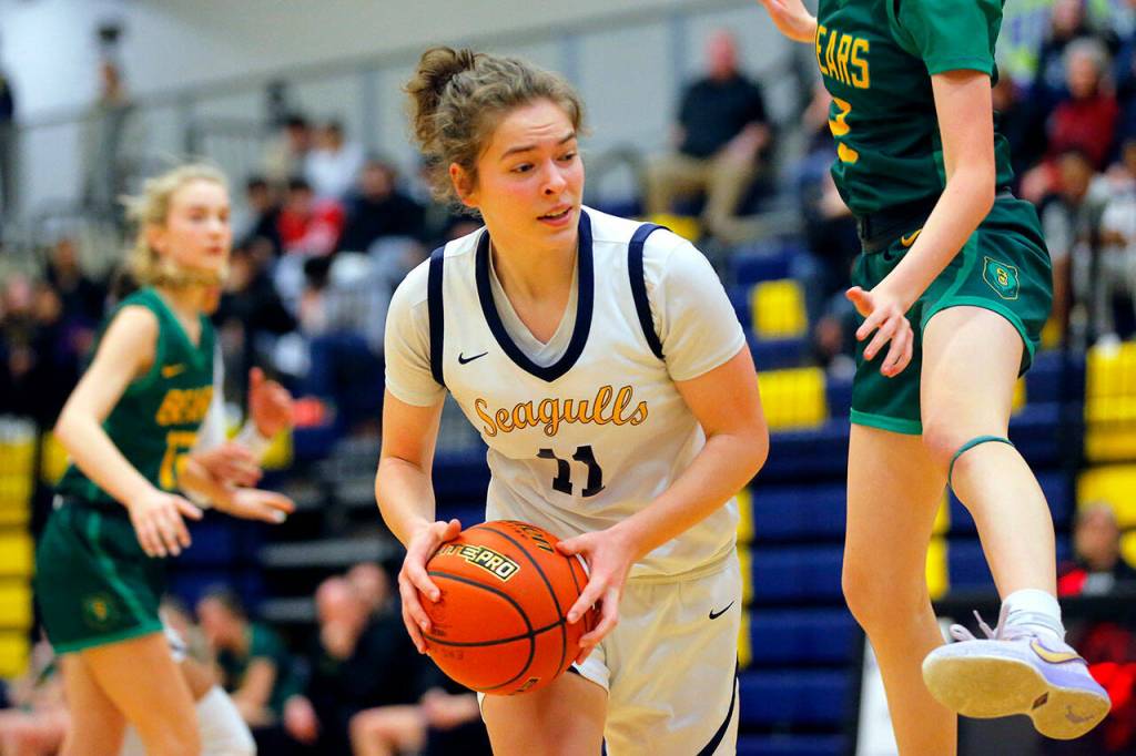 Everetts Lanie Thompson gets a defender in the air against Bishop Blanchet during a first round playoff game on Tuesday, Feb. 21, 2023, at the Norm Lowery Gymnasium in Everett, Washington. (Ryan Berry / The Herald)