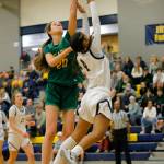 Bishop Blanchets Emerson Ludwick blocks a shot by Everetts Mylie Wugumgeg during a first round playoff game on Tuesday, Feb. 21, 2023, at the Norm Lowery Gymnasium in Everett, Washington. (Ryan Berry / The Herald)