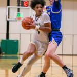 Shorecrests Keaine Silimon tries to maneuver around a Stadium player while his pushes to the hoop during the game against Stadium on Tuesday, Feb. 21, 2023 in Shoreline, Washington. (Olivia Vanni / The Herald)