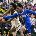 Shorecrests Adarrius Hilliard and Stadiums Baaroc Rivers both reach out to grab the ball during the game against Stadium on Tuesday, Feb. 21, 2023 in Shoreline, Washington. (Olivia Vanni / The Herald)