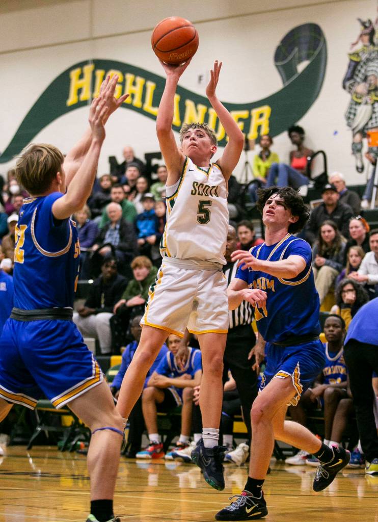 Shorecrests Brayden Fischer attempts a three-point shot during the game against Stadium on Tuesday, Feb. 21, 2023 in Shoreline, Washington. (Olivia Vanni / The Herald)