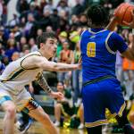 Shorecrests Parker Baumann reaches out to to try and block a pass by Stadiums NeQuan Brown during the game against Stadium on Tuesday, Feb. 21, 2023 in Shoreline, Washington. (Olivia Vanni / The Herald)