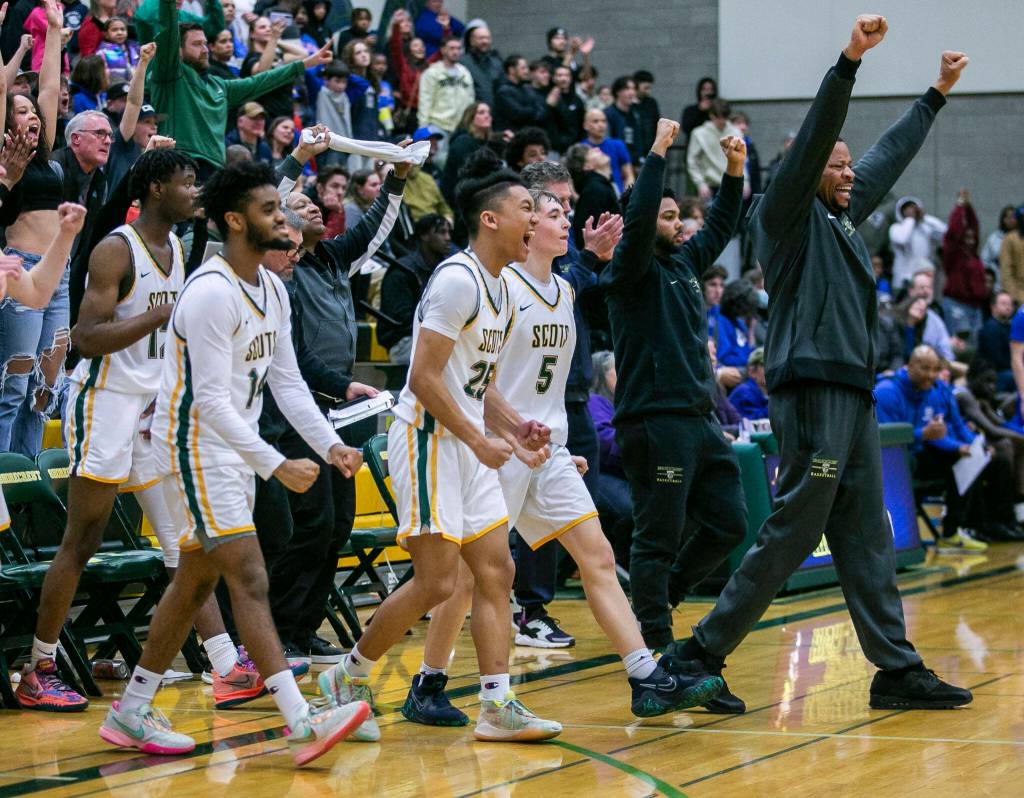 The Shorecrest players and coaches reacts to beating Stadium on Tuesday, Feb. 21, 2023 in Shoreline, Washington. (Olivia Vanni / The Herald)