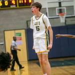 Shorecrests Darek Usitalo yells and leaps in the air in celebration of beating Stadium on Tuesday, Feb. 21, 2023 in Shoreline, Washington. (Olivia Vanni / The Herald)