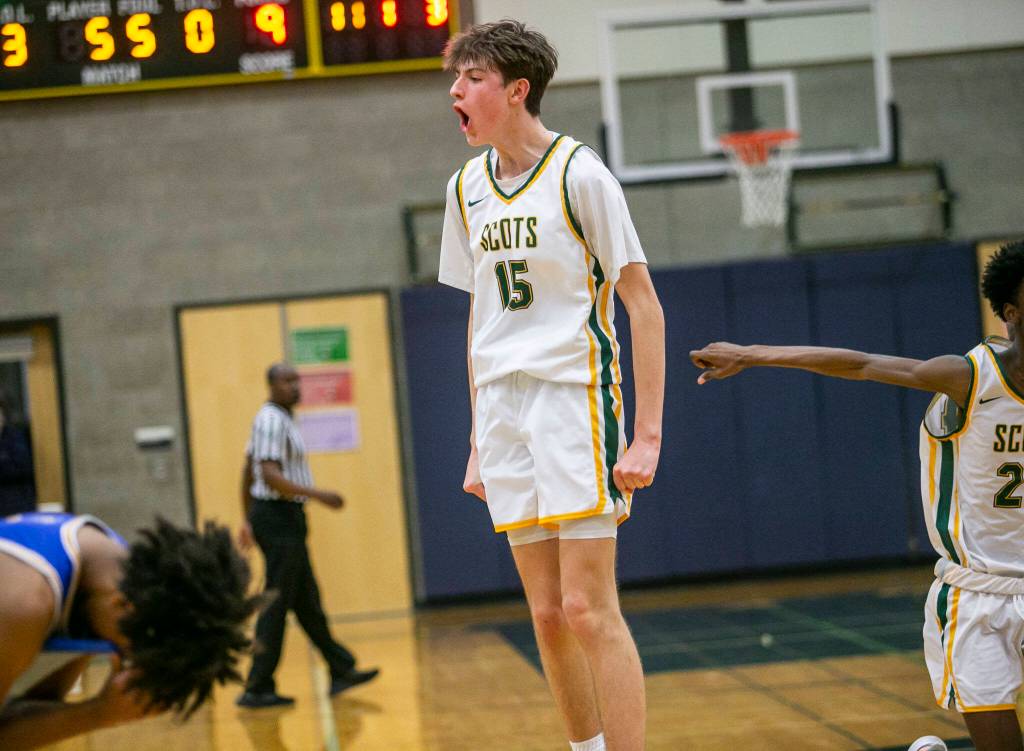 Shorecrests Darek Usitalo yells and leaps in the air in celebration of beating Stadium on Tuesday, Feb. 21, 2023 in Shoreline, Washington. (Olivia Vanni / The Herald)