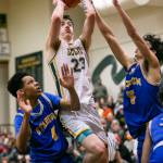 Shorecrests Parker Baumann attempts a jumpshot while being guarded during the game against Stadium on Tuesday, Feb. 21, 2023 in Shoreline, Washington. (Olivia Vanni / The Herald)