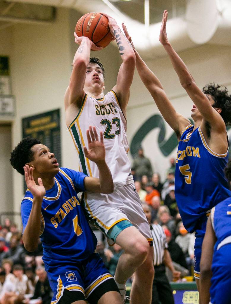 Shorecrests Parker Baumann attempts a jumpshot while being guarded during the game against Stadium on Tuesday, Feb. 21, 2023 in Shoreline, Washington. (Olivia Vanni / The Herald)