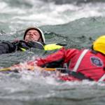 Firefighters perform a rescue during the Snohomish Regional Fire and Rescues annual Water Rescue Academy on the Skykomish River near Index in May, 2022. (Kevin Clark / The Herald file photo)