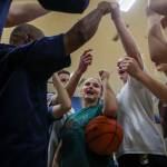 Sultan players huddle during a girls basketball practice at Sultan High School on Thursday. (Annie Barker / The Herald)