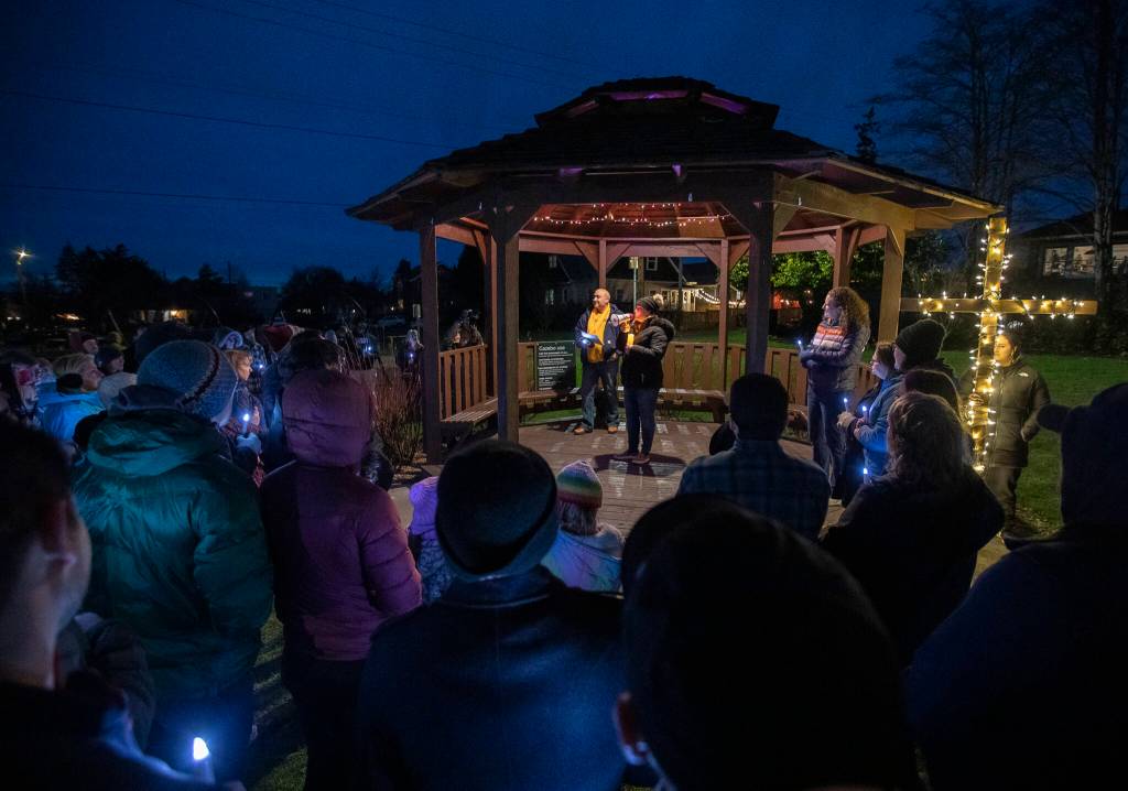 Nurses and community members gather at Drew Nielsen Neighborhood Park while Valerie Whorton, RN, BSN, speaks about the need for safer staffing standards in light of increasing patient loads at Providence on Saturday, Feb. 25, 2023 in Everett, Washington. (Olivia Vanni / The Herald)