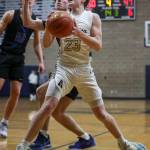 Arlingtons Leyton Martin (23) shoots the ball during a state playoff game against Walla Walla at Arlington High School on Saturday. Arlington won 68-57. (Annie Barker / The Herald)