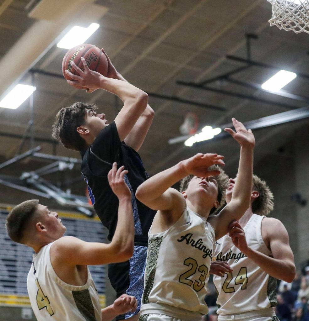 Walla Wallas Cameron Carrara (33) shoots the ball during a state playoff game against Arlington at Arlington High School on Saturday. Arlington won 68-57. (Annie Barker / The Herald)
