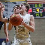Arlington’s Leyton Martin (23) shoots the ball during a game between the Arlington Eagles and Walla Walla Blue Devils at Arlington High School in Arlington, Washington on Saturday, Feb. 25, 2023. Arlington won, 68-57. (Annie Barker / The Herald)