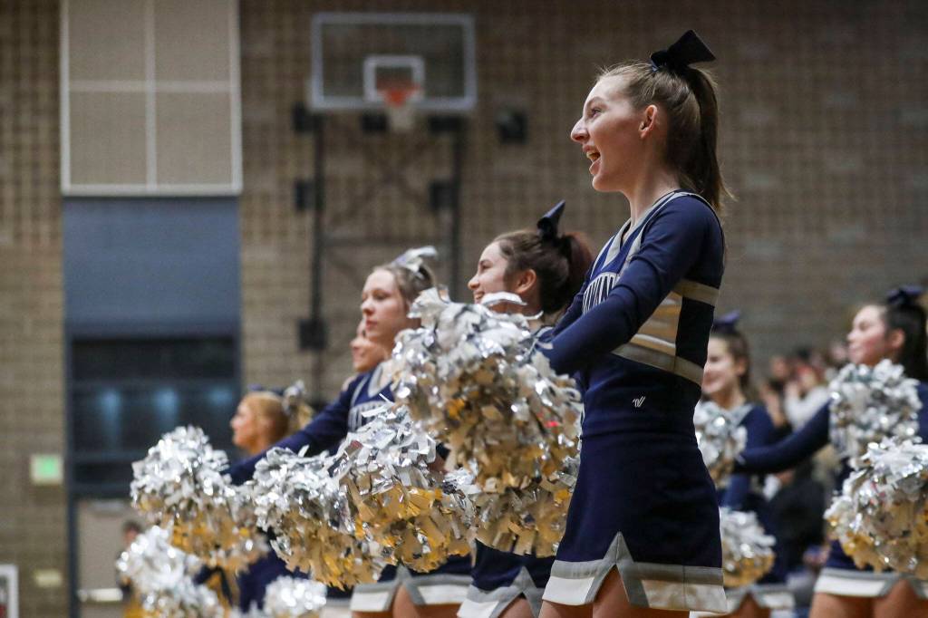 Chiawana cheerleaders shout during a state playoff game against Mariner at Arlington High School on Saturday. Mariner won 85-74. (Annie Barker / The Herald)
