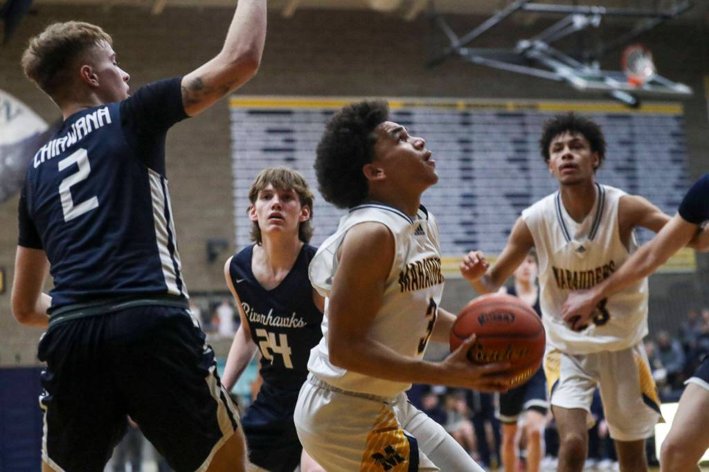 Mariners Macky James (3) shoots the ball during a state playoff game against Chiawana at Arlington High School on Saturday. Mariner won 85-74. (Annie Barker / The Herald)