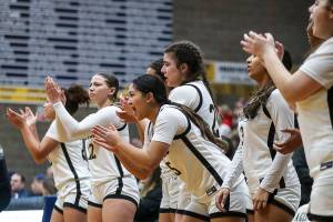 Lynnwood players cheer during a game between the Lynnwood Royals and West Seattle Wildcats at Arlington High School in Arlington Washington on Saturday, Feb. 25, 2023. Lynnwood won, 47-45.  (Annie Barker / The Herald)