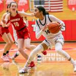 Everett’s  Mae Washington fakes out her defender to make space for a shot during the game against Snohomish on Saturday, Feb. 18, 2023 in Everett, Washington. (Olivia Vanni / The Herald)