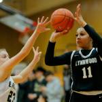 Lynnwood’s Teyah Clark hits a three from the corner against Arlington on Tuesday, Feb. 14, 2023, at Marysville Pilchuck High School in Marysville, Washington. (Ryan Berry / The Herald)