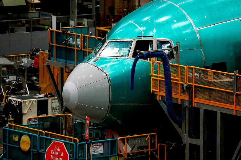 The nose of a Boeing 777 freighter is seen at Boeings Everett Production Facility on June 15, in Everett. (Jennifer Buchanan/The Seattle Times via AP, Pool)