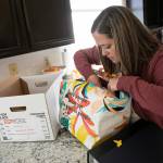 Marie Riley, 42, digs through old photos and documents in Oct. 25, at her familys home in North Bend. (Ryan Berry / The Herald)