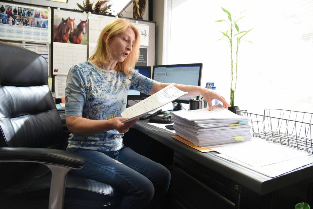 Galina Volchkova, the Volunteers of America Housing Director, discusses the volume of applications for rental assistance her office received on June 18, 2021. (Katie Hayes / The Herald)