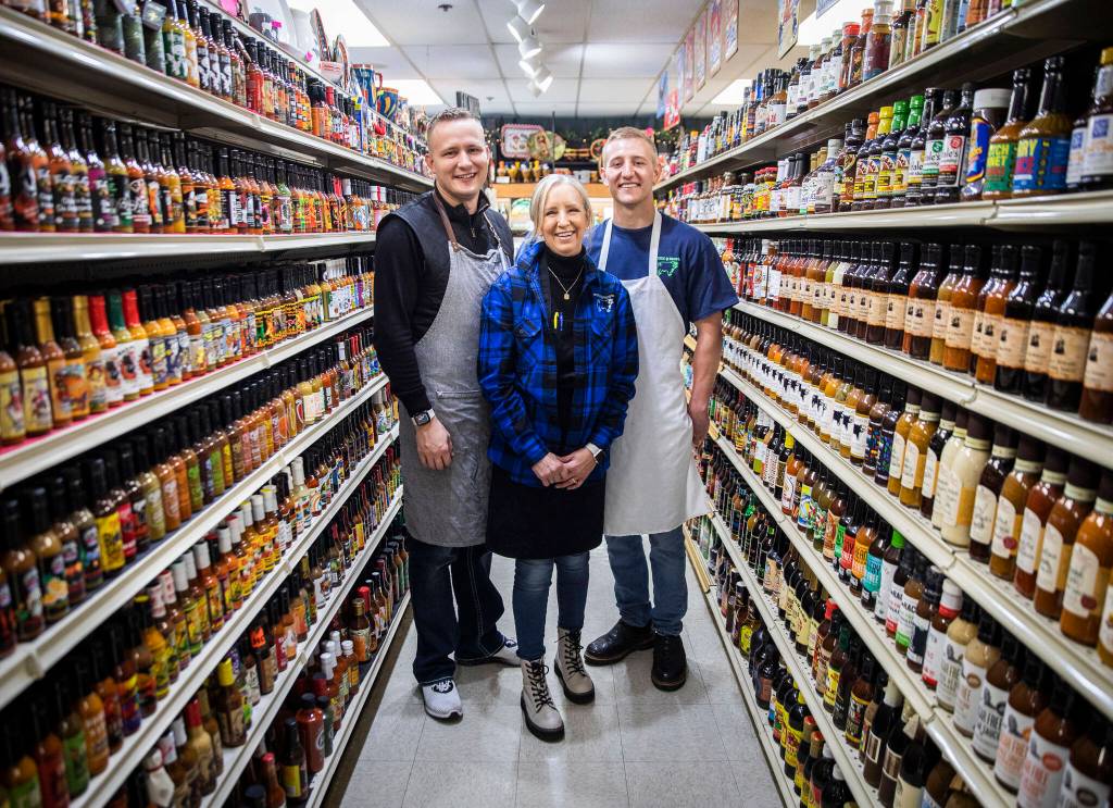 From left, Justin, Kim and Jeremy Nygard at their family store Double DD Meats in Mountlake Terrace. (Olivia Vanni / The Herald)
