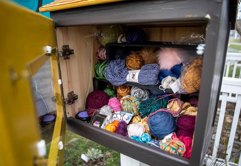 Inside the Little (free) Yarn Shoppe outside the home of Willow Mietus, 50, in Coupeville. Mietus puts her leftover yarn inside this cabinet for other people to take. (Annie Barker / The Herald)