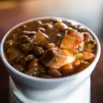 A cup of fresh brisket baked beans from Jeffs Texas Style BBQ in Marysville. (Olivia Vanni / The Herald)