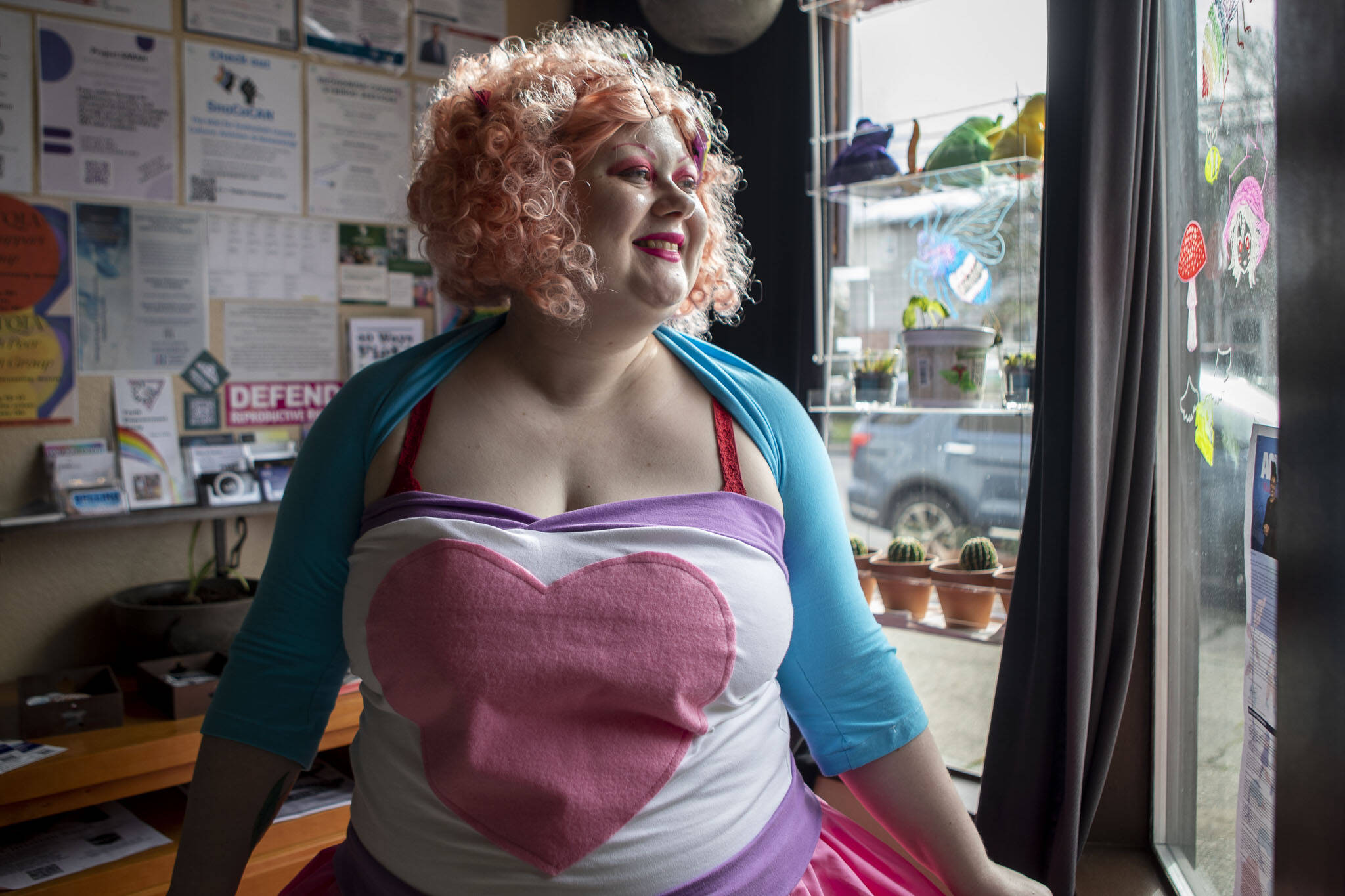 Lexi Angel, 30, poses for a photo cosplaying as Pinkie Pie from My Little Pony: Equestria Girls at Catalyst Café in Everett, Washington on Wednesday, Feb. 22, 2023. Angel is speaking on a panel called Body Positivity In The Cosplay Community at this years Emerald City Comic Con. (Annie Barker / The Herald)