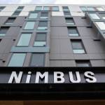 The Nimbus Apartments tower nine stories into the sky in downtown Everett. (Ryan Berry / The Herald)