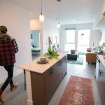 Property manager Dynasty Williams walks through a one-bedroom unit at the Nimbus Apartments. (Ryan Berry / The Herald)