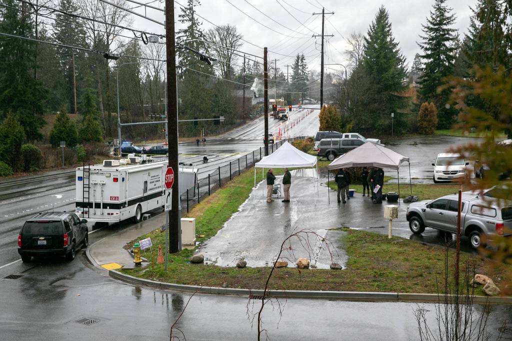 Snohomish County Incident Command is set up in front of Holy Cross Lutheran Church along 20th Street SE near Route 9 after a police-involved shooting left one person dead Friday, Jan. 13, 2023, in Lake Stevens, Washington. (Ryan Berry / The Herald)