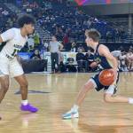 Arlingtons Leyton Martin (right) brings the ball up court against Auburns Tyrell Nichols during a 3A state playoff game on Wednesday, March 1, 2023, at the Tacoma Dome. (Nick Patterson / The Herald)
