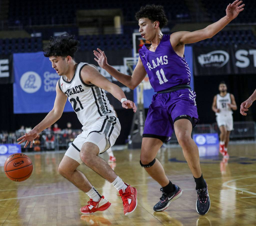 Mountlake Terraces Logan Tews (21) moves with the ball during a 3A boys game in the Hardwood Classic between Mountlake Terrace and North Thurston at the Tacoma Dome in Tacoma, Washington on Wednesday, March 1, 2023. Mountlake Terrace won, 58-53. (Annie Barker / The Herald)