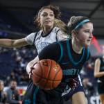 Bonney Lakes Ava Bailey (2) moves with the ball during a 3A girls game in the Hardwood Classic between Meadowdale and Bonney Lake at the Tacoma Dome in Tacoma, Washington on Wednesday, March 1, 2023. Meadowdale won, 62-35.(Annie Barker / The Herald)