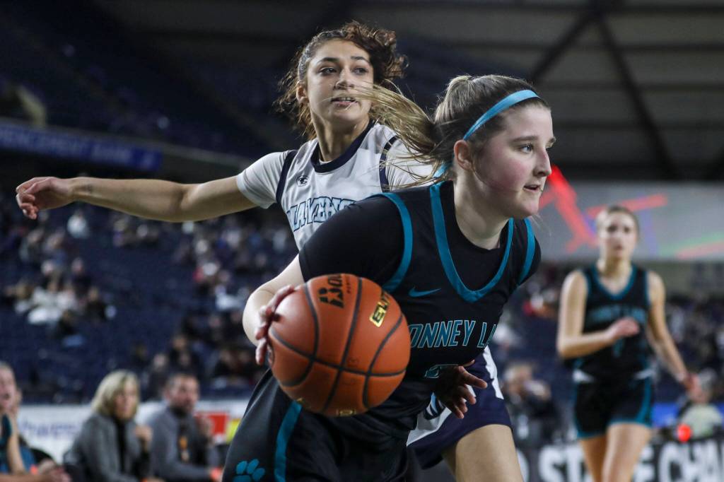 Bonney Lakes Ava Bailey (2) moves with the ball during a 3A girls game in the Hardwood Classic between Meadowdale and Bonney Lake at the Tacoma Dome in Tacoma, Washington on Wednesday, March 1, 2023. Meadowdale won, 62-35.(Annie Barker / The Herald)