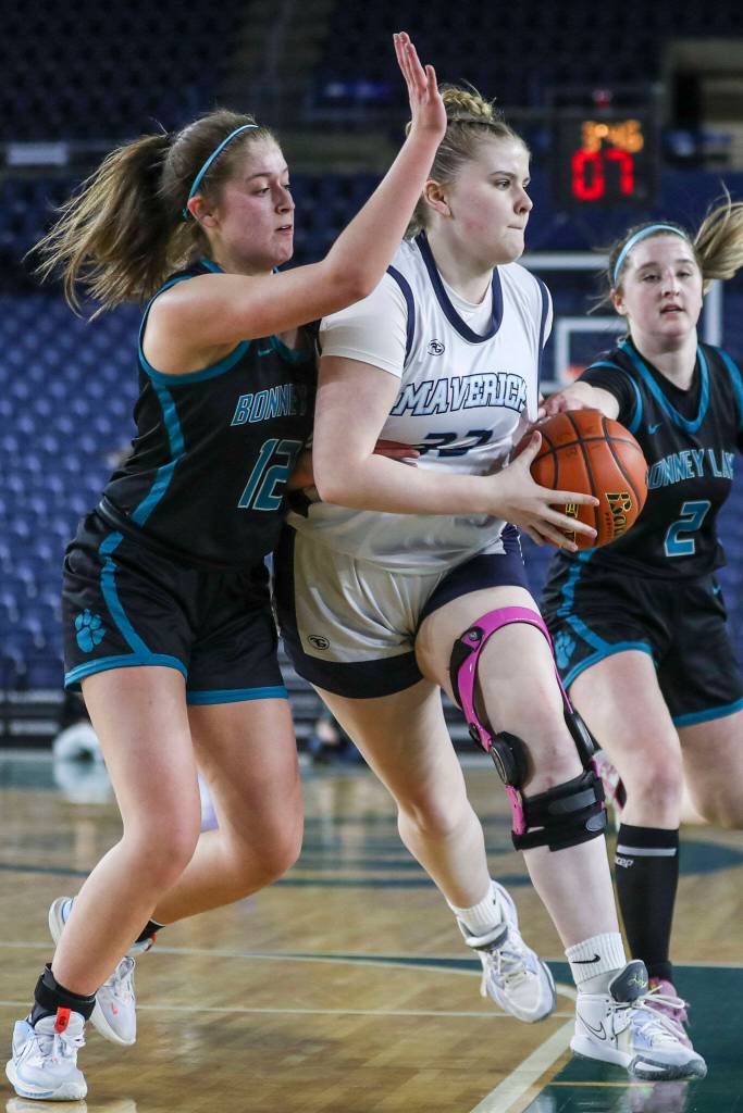 Meadowdales Mackenzie Tindall (33) moves with the ball during a 3A girls game in the Hardwood Classic between Meadowdale and Bonney Lake at the Tacoma Dome in Tacoma, Washington on Wednesday, March 1, 2023. Meadowdale won, 62-35.(Annie Barker / The Herald)