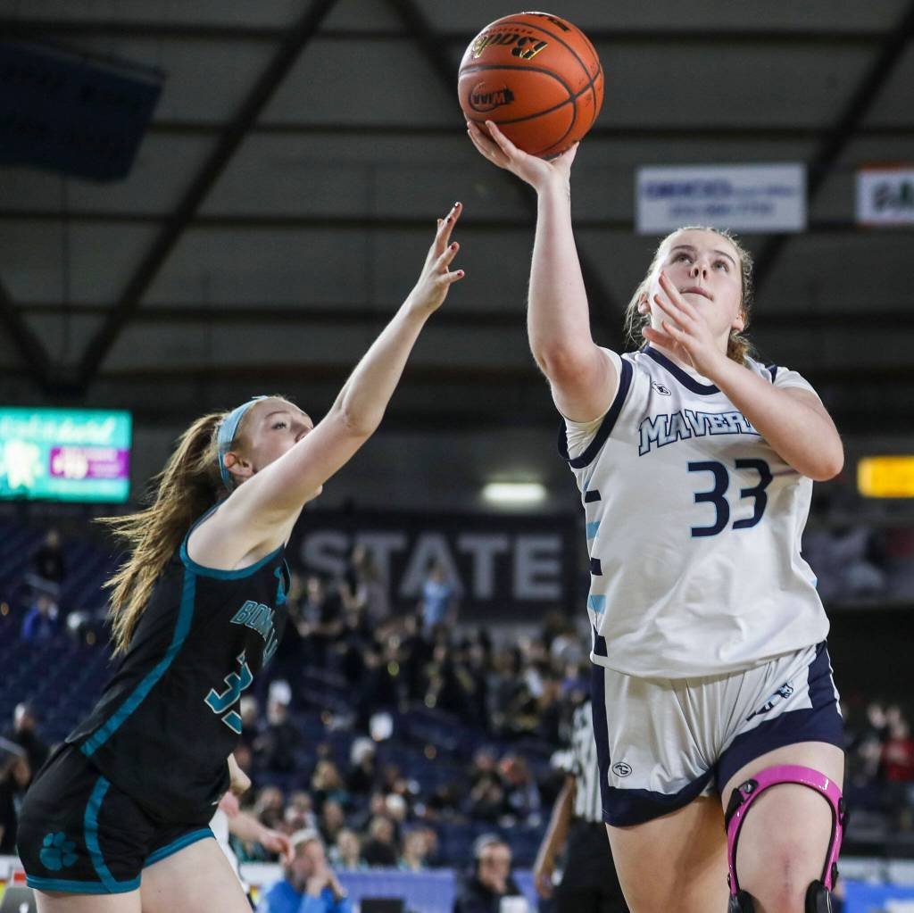 Meadowdales Mackenzie Tindall (33) shoots the ball during a 3A girls game in the Hardwood Classic between Meadowdale and Bonney Lake at the Tacoma Dome in Tacoma, Washington on Wednesday, March 1, 2023. Meadowdale won, 62-35.(Annie Barker / The Herald)