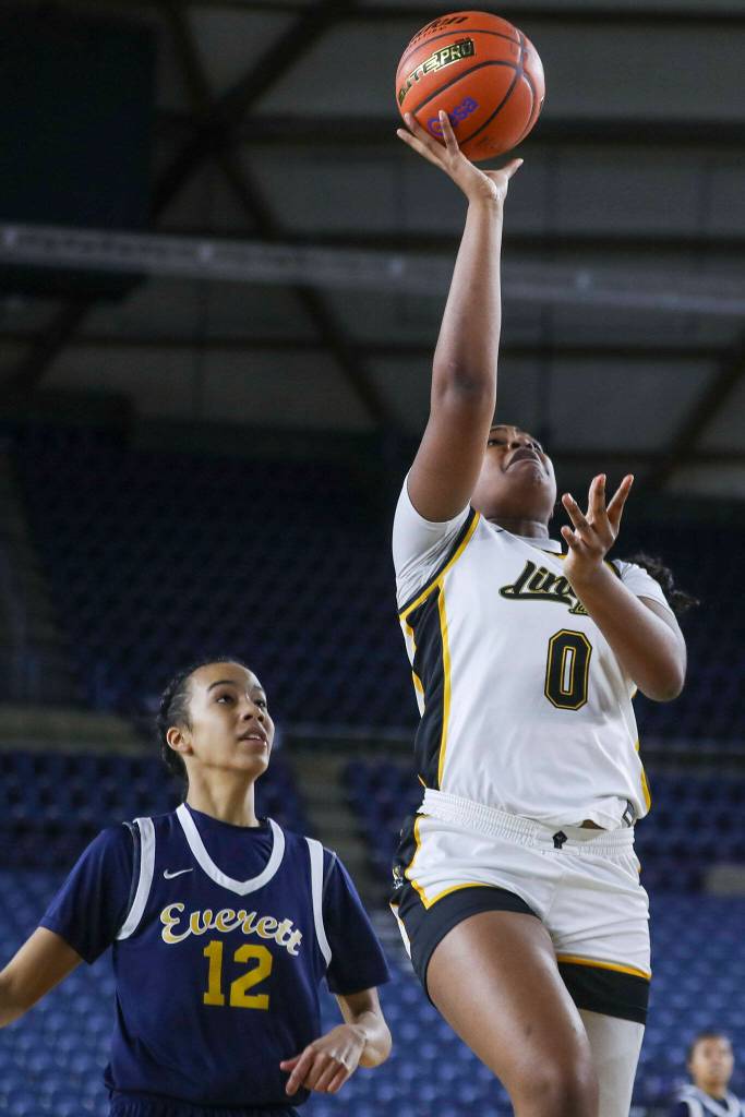 Lincolns DeAndrea Woods-Singleton (0) shoots the ball during a 3A girls game in the Hardwood Classic between Everett and Lincoln at the Tacoma Dome in Tacoma, Washington on Wednesday, March 1, 2023. Everett fell, 43-45. (Annie Barker / The Herald)