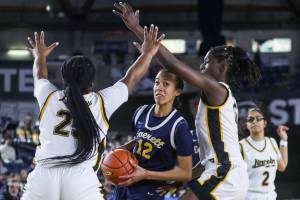 Everett’s Alana Washington (12) moves with the ball during a 3A girls game in the Hardwood Classic between Everett and Lincoln at the Tacoma Dome in Tacoma, Washington on Wednesday, March 1, 2023. Everett fell, 43-45. (Annie Barker / The Herald)
