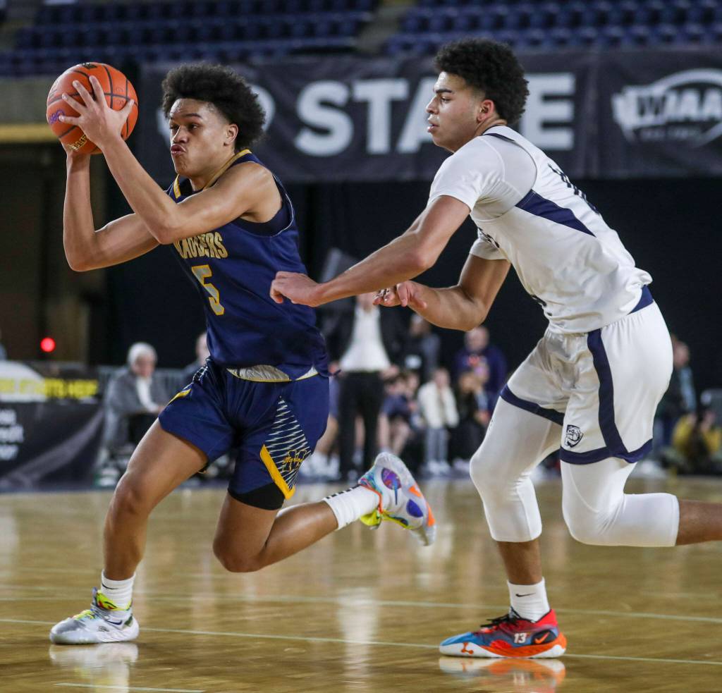 Mariners Makai Bloomfield (5) moves with the ball during a 3A boys game in the Hardwood Classic between Gonzaga Prep and Mariner at the Tacoma Dome in Tacoma, Washington on Wednesday, March 1, 2023. The Marauders fell, 79-69. (Annie Barker / The Herald)