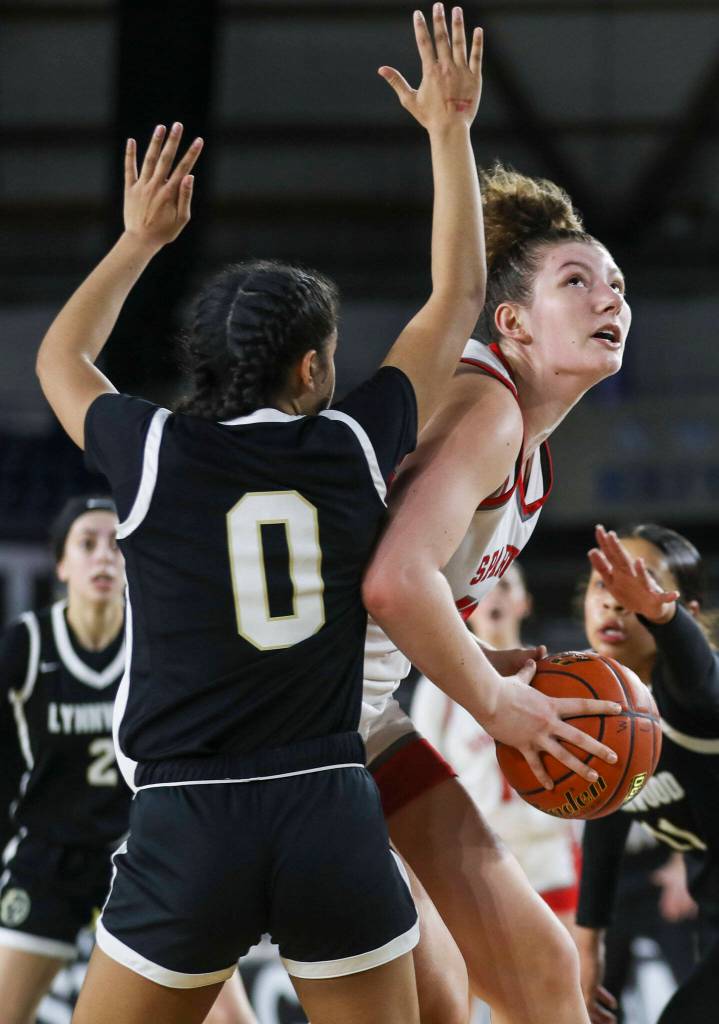 Stanwoods Vivienne Berrett (53) shoots the ball during a 3A girls game in the Hardwood Classic between Lynnwood and Stanwood at the Tacoma Dome in Tacoma, Washington on Wednesday, March 1, 2023. Stanwood won, 74-69. (Annie Barker / The Herald)