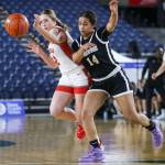 Stanwoods Ellalee Wortham (2) and Lynnwoods Dina Yonas (14) fight for the ball during a 3A girls game in the Hardwood Classic between Lynnwood and Stanwood at the Tacoma Dome in Tacoma, Washington on Wednesday, March 1, 2023. Stanwood won, 74-69. (Annie Barker / The Herald)