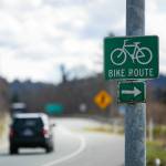 A sign diverts bicyclists to a short path that leads to the shoulder of eastbound U.S. 2 near the junction with Highway 204 in Lake Stevens. (Ryan Berry / The Herald)
