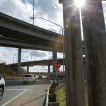 Drivers heading south Monday exit Highway 204 and pass under U.S. 2 in Lake Stevens. Cyclists attempting to follow U.S. 2 eastbound are directed by a sign to a short path that goes under an overpass before reaching the shoulder of the highway. (Ryan Berry / The Herald)